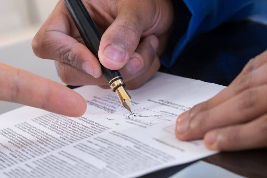 Image depicting a contract signing