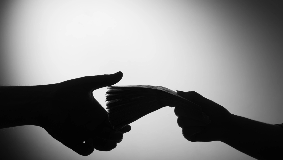 Image of money changing hands