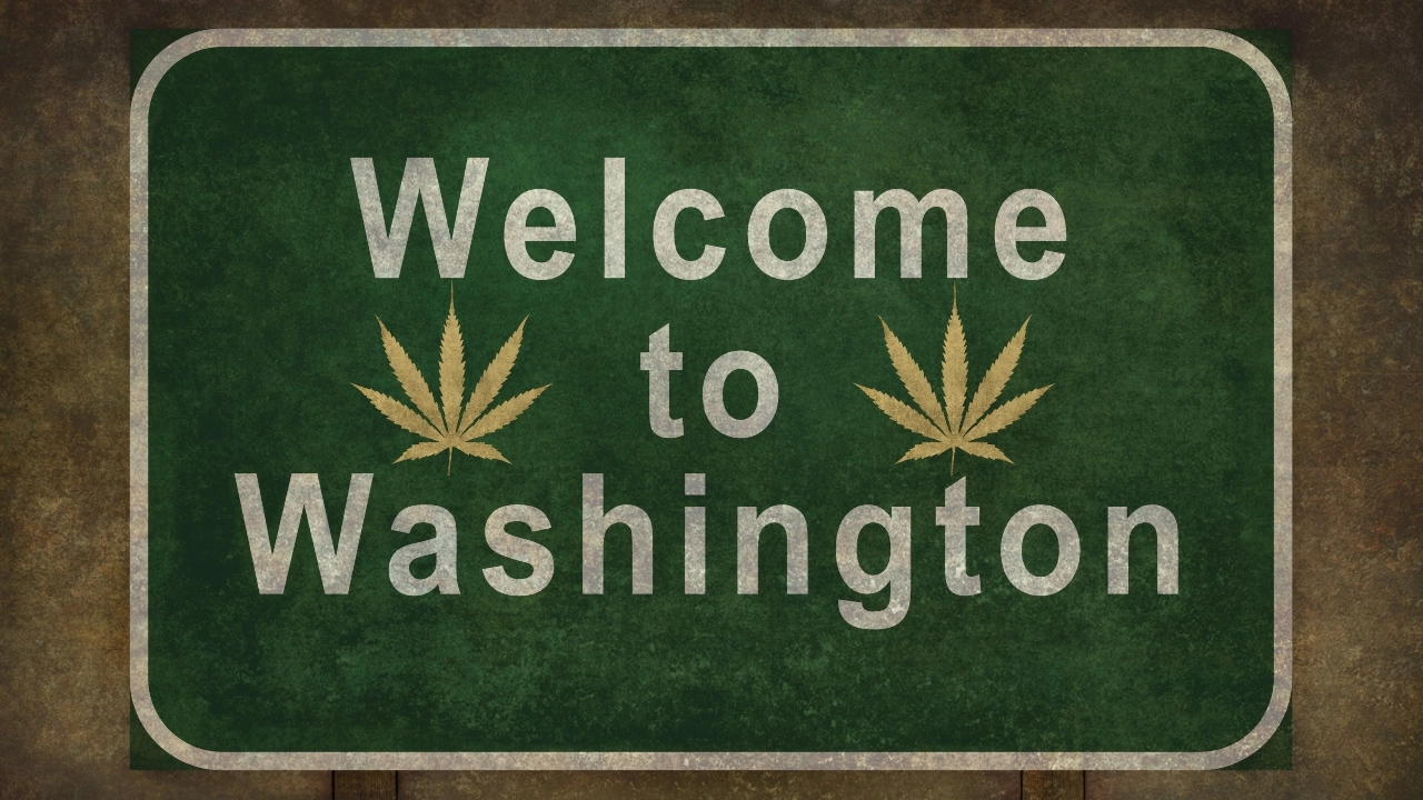 Image of a Welcome to Washington sign bearing cannabis leaves