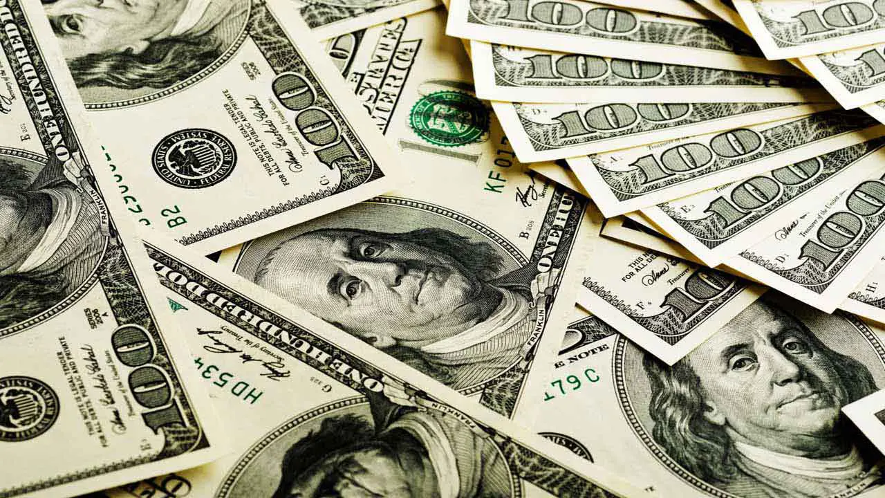 Image of a pile of $100 bills