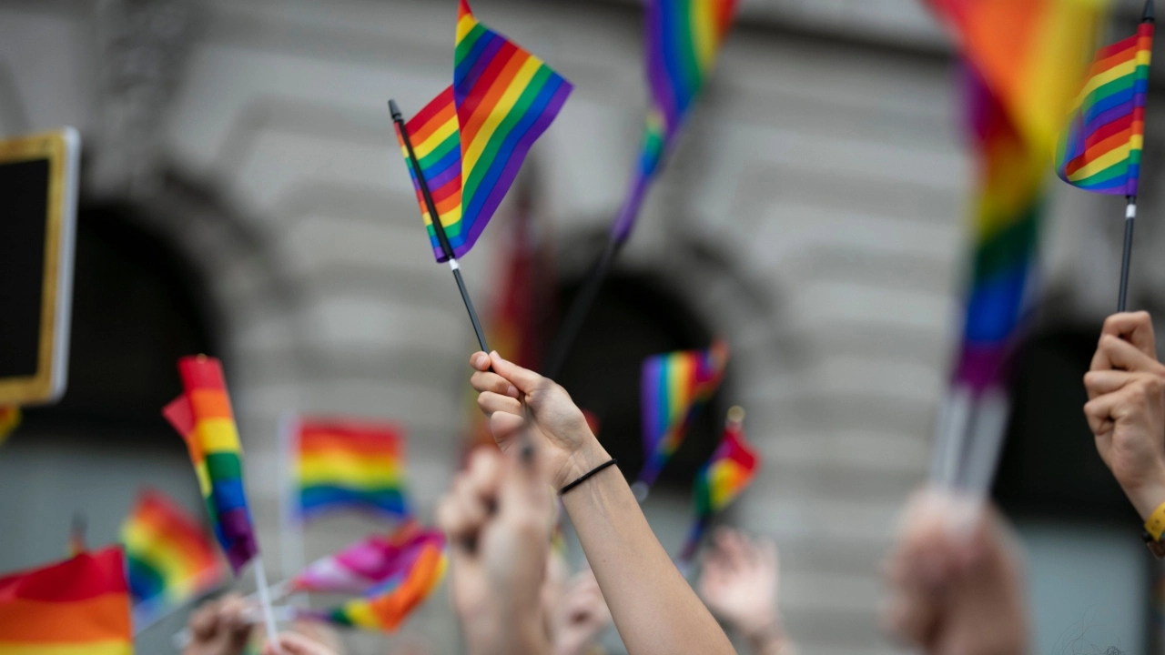 Image of people waving LGBTQ Pride flags at a solidarity march
