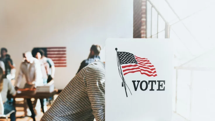 Image of a U.S. citizen in a voting booth