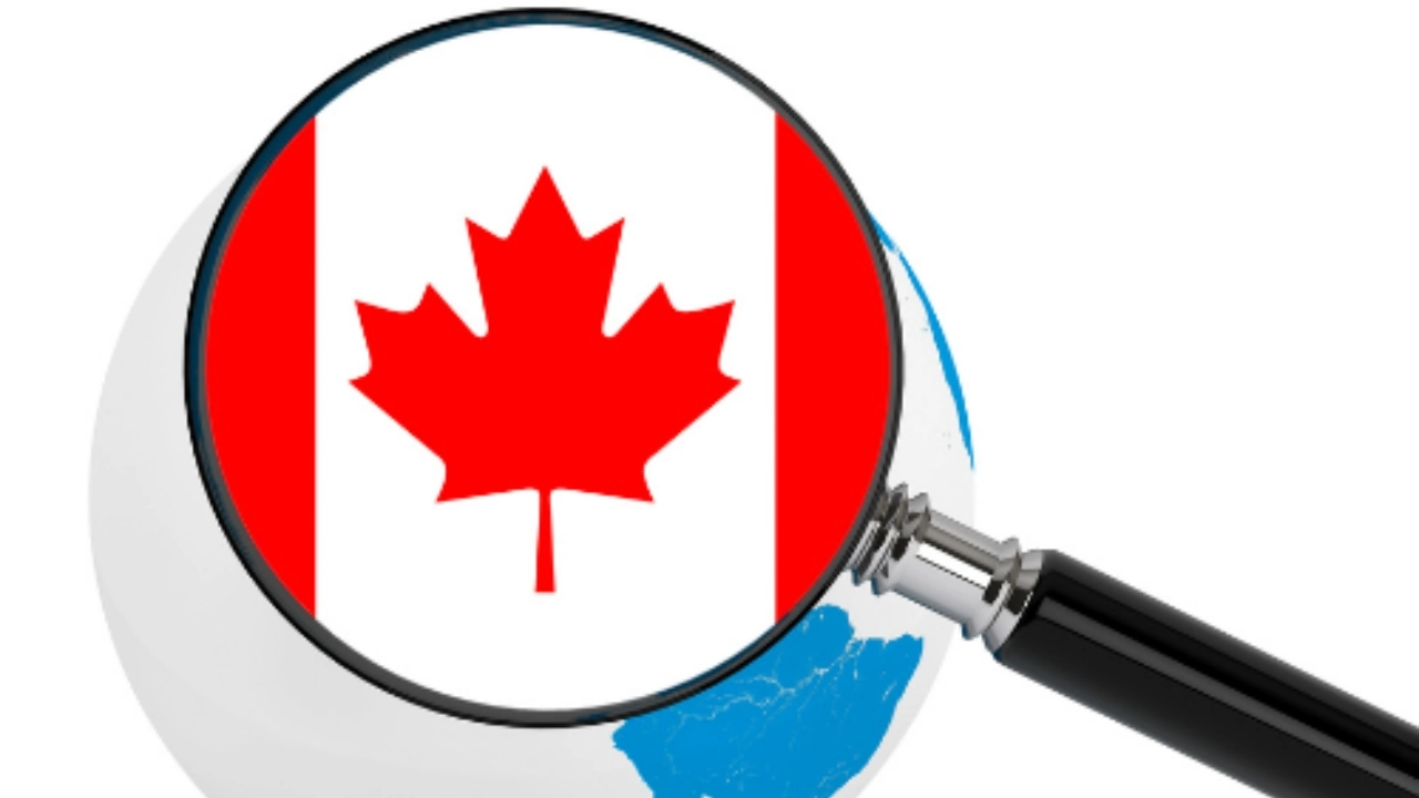Image of a magnifying glass over the Canadian flag hovering above Earth