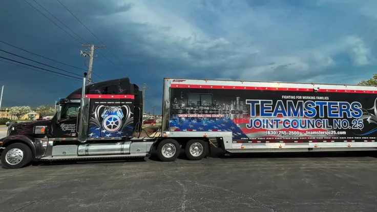 Image of a Teamsters Joint Council 25 semitrailer showing support for striking workers