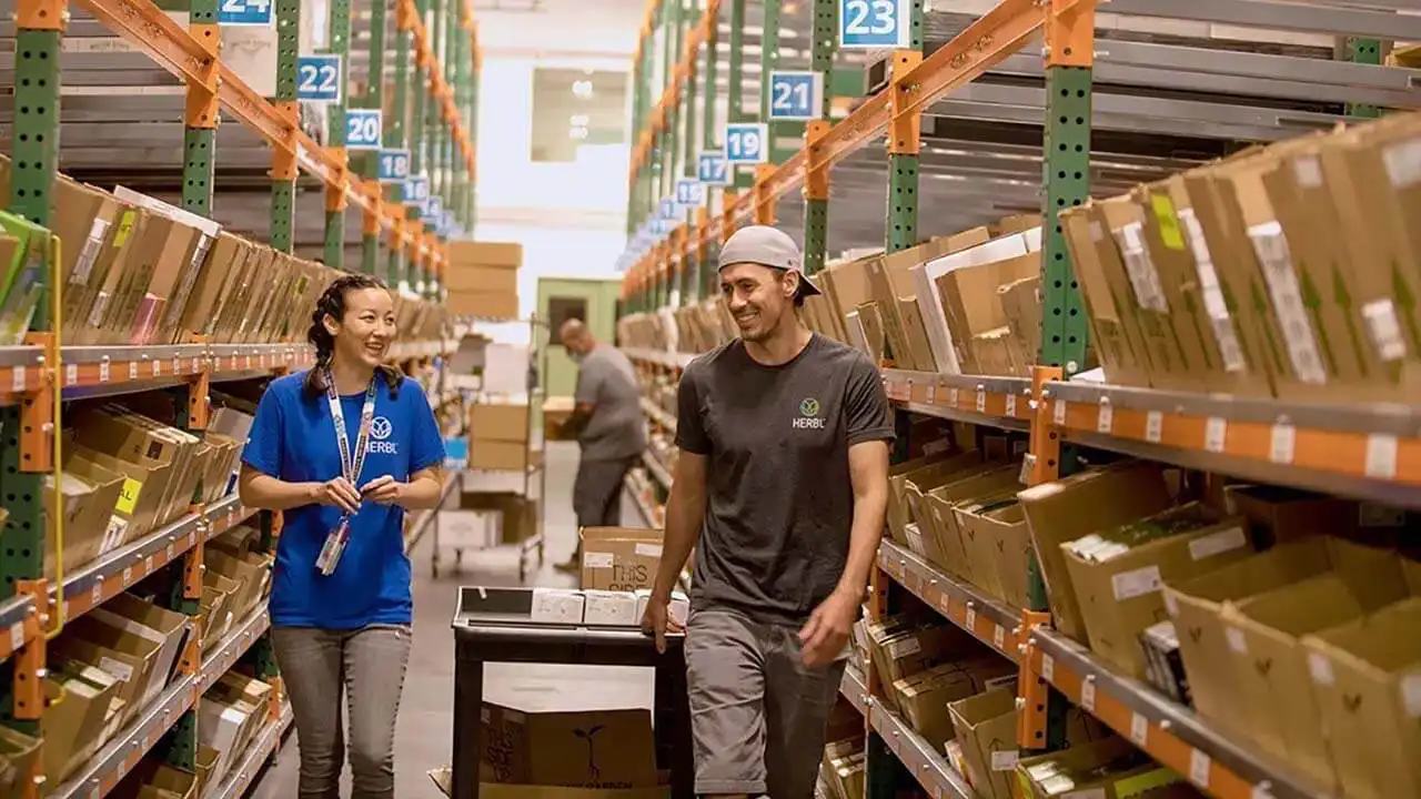 Image of workers in Herbl warehouse