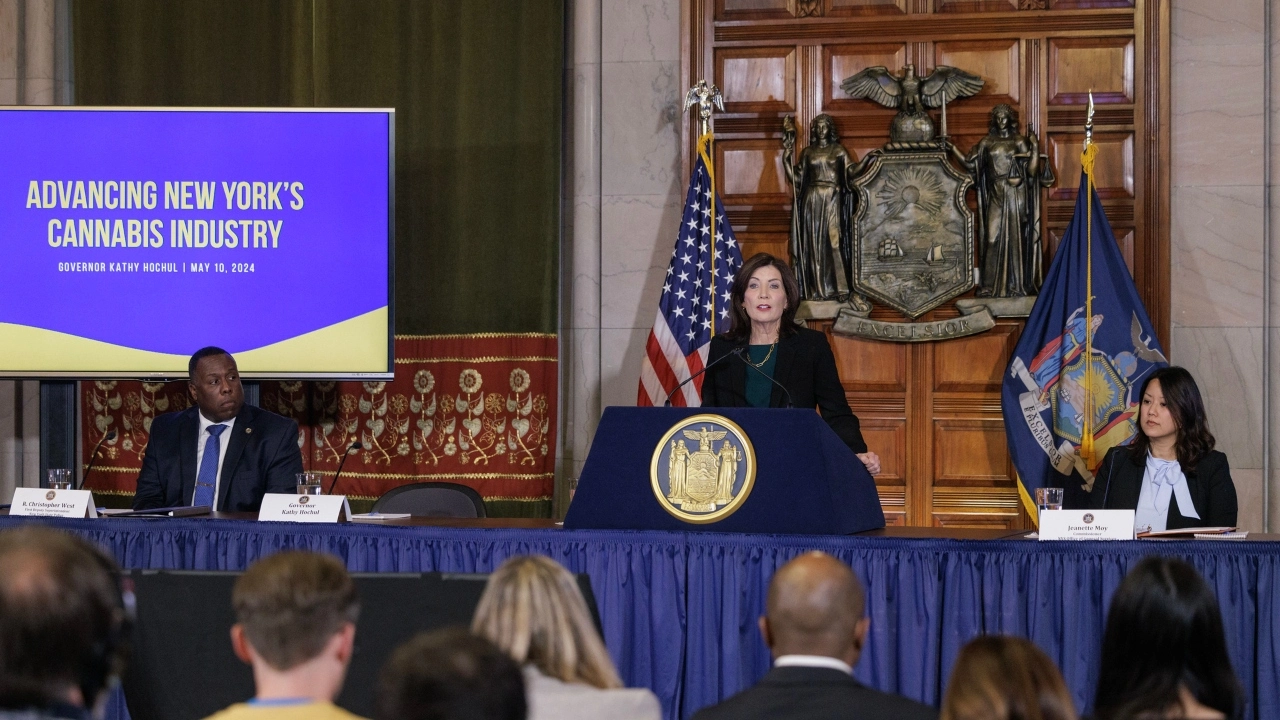 Image of New York Gov. Kathy Hohul at a news conference with Christopher West, the first deputy superintendent of the State Police, and Jeanette Moy, the commissioner of the Office of General Services.