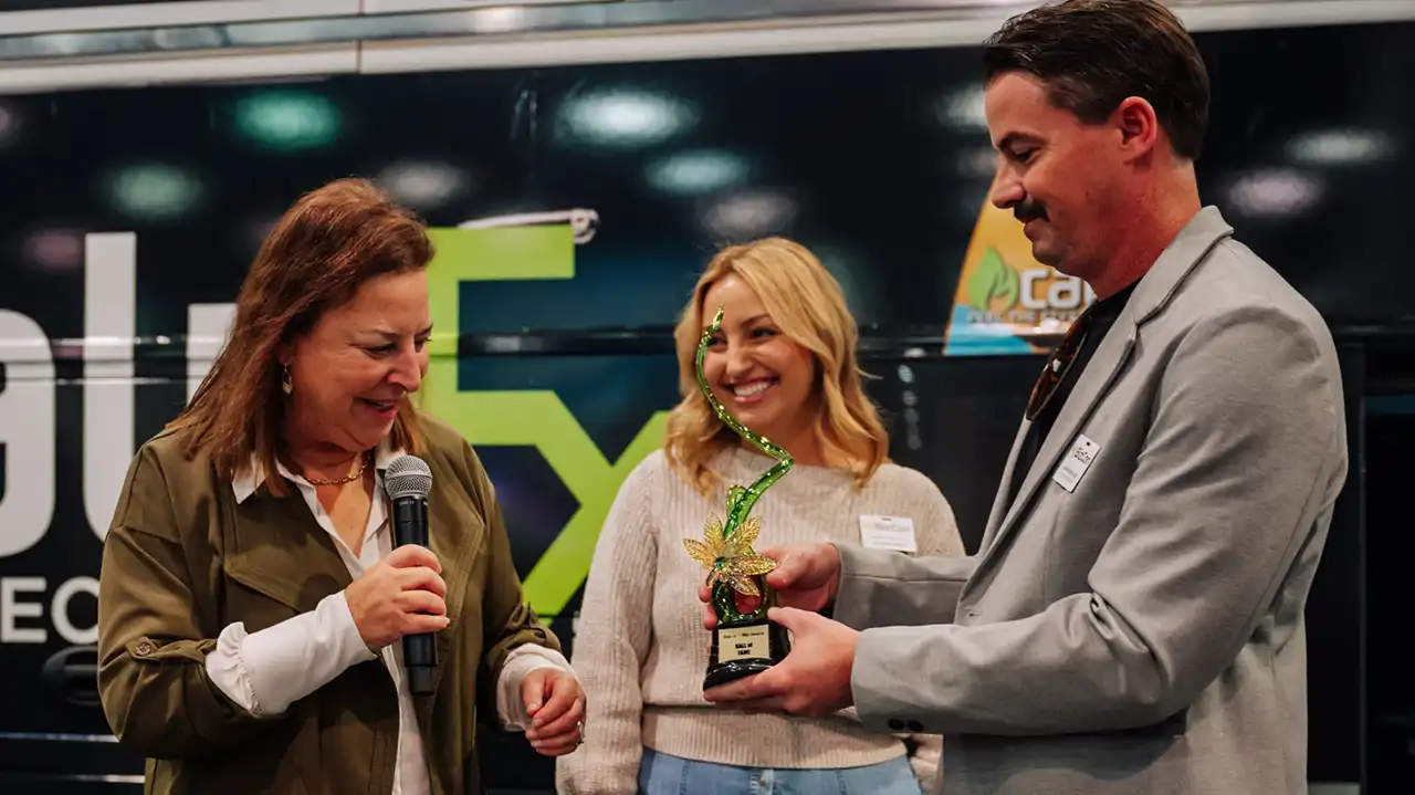 Image of Nancy Whiteman, left, accepting an MJBiz Hall of Fame Award